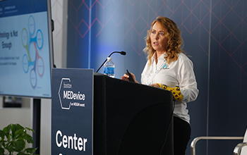 a speaker is presenting at MEDevice keynote session